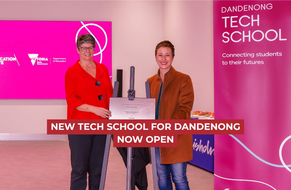 Gabrielle Williams stands beside the commemorative opening plague for the Tech School in Dandenong
