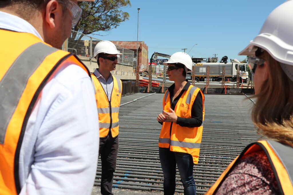 Gabrielle Williams stands at the construction site of the Webster Street Level Crossing Removal